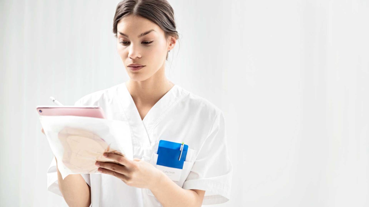 nurse at hospital holding a list