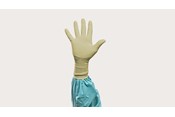 A hand gloved in Biogel surgical gloves