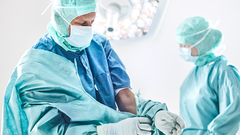 Surgeon using Biogel gloves